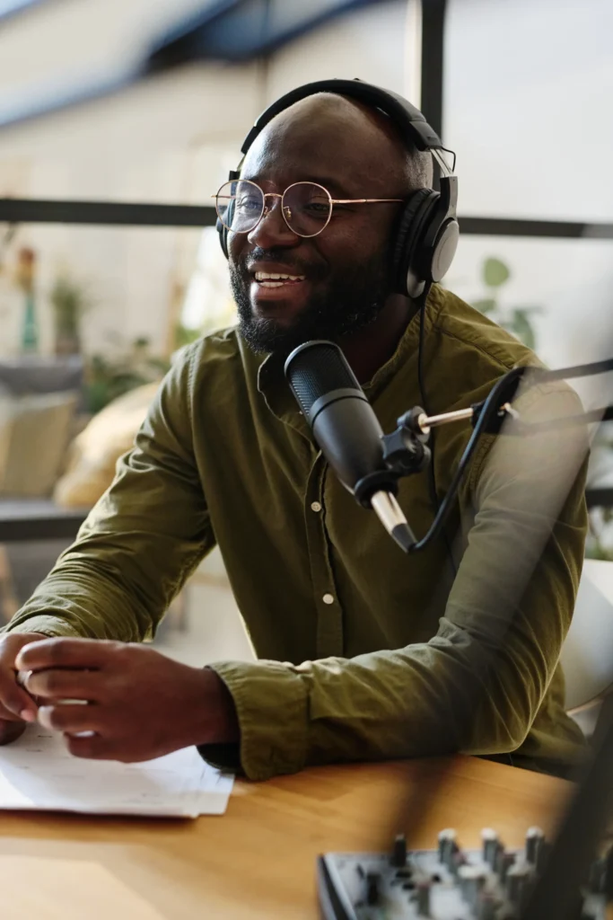 young cheerful black man in headphones