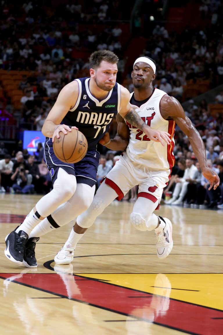 MIAMI, FLORIDA - APRIL 01: Luka Doncic #77 of the Dallas Mavericks drives against Jimmy Butler #22 of the Miami Heat during the first quarter at Miami-Dade Arena on April 01, 2023 in Miami, Florida. NOTE TO USER: User expressly acknowledges and agrees that, by downloading and or using this photograph, User is consenting to the terms and conditions of the Getty Images License Agreement. (Photo by Megan Briggs/Getty Images)