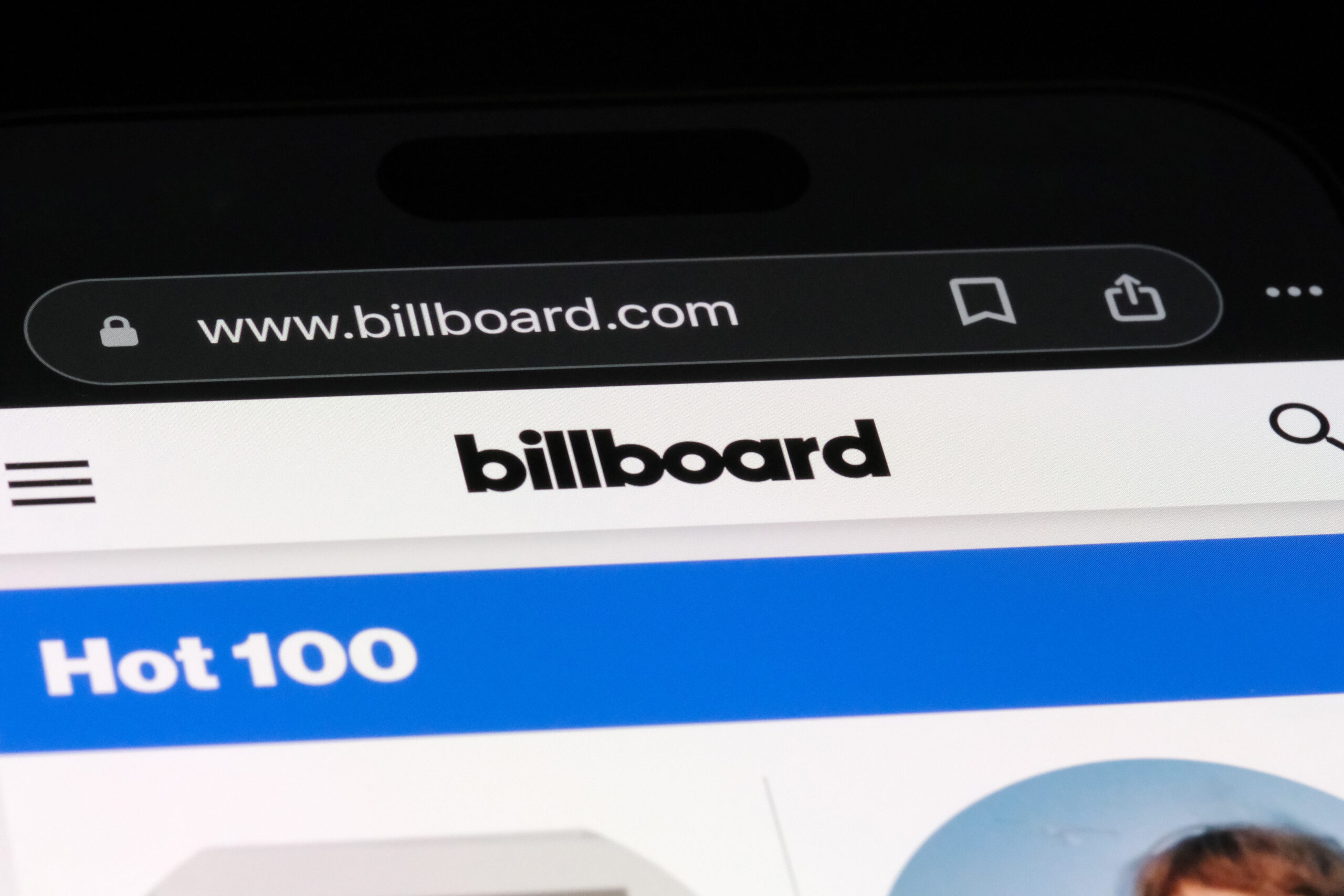 Billboard Hot 100 viewed on a mobile device. (Adobe Stock)