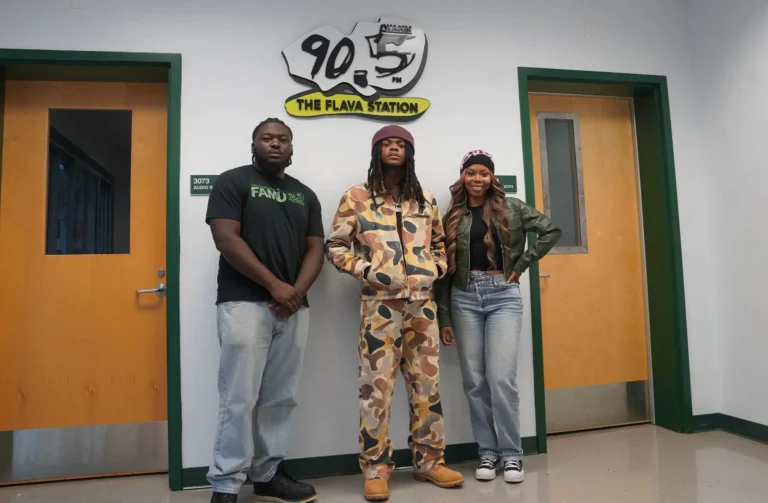 Singer Tyler Watts (center) poses with WANM staff, Elijah Lott (left) & Clarissa Elysee (right)