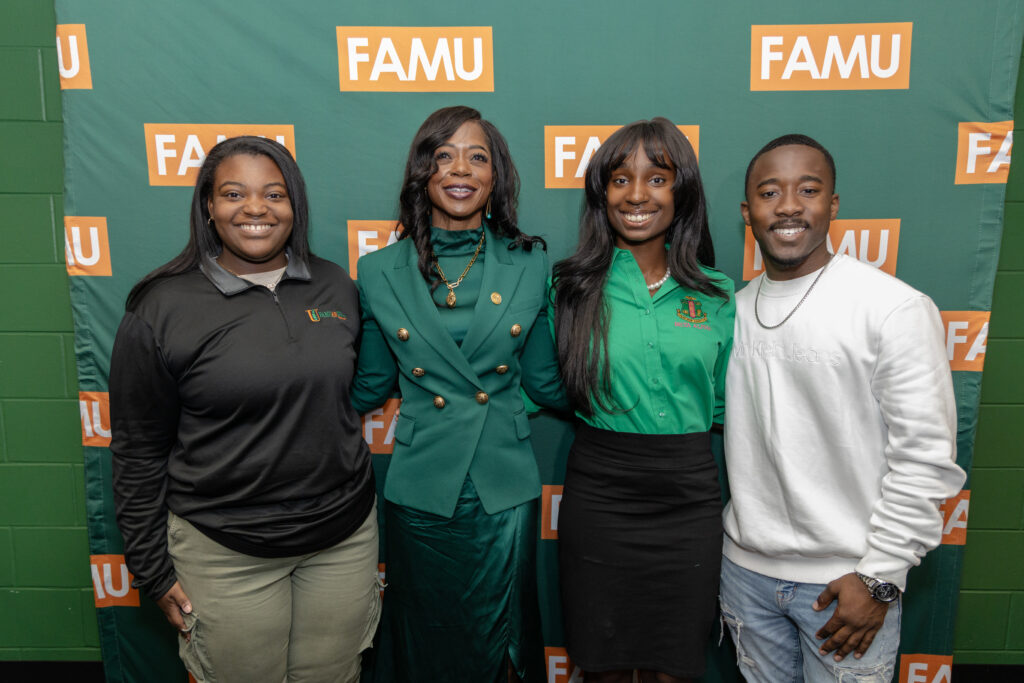 Marva Johnson with Janelle Sears, Naji Rutherford and Cameron Young, pictured left to right. (WANM Staff)