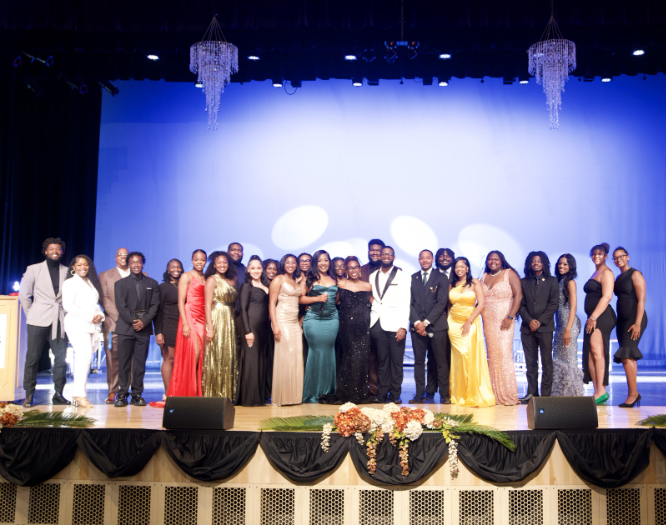 College of Love and Charity Award Recipient & Committee on stage. (Alicia Adams/WANM)